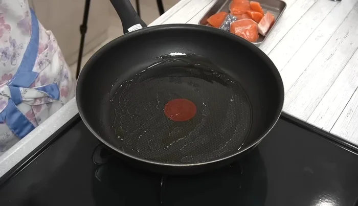 Lightly fry the salmon in olive oil until browned on both sides.