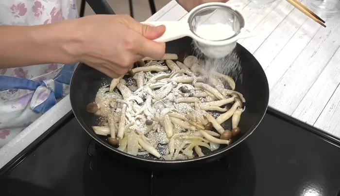 Sprinkle flour over the cooked vegetables and stir until combined.