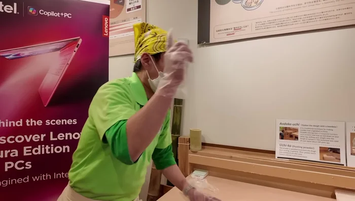 Place the flattened dough about 15 cm from the corner of the table.