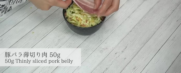 Place sliced pork belly on top of the batter.