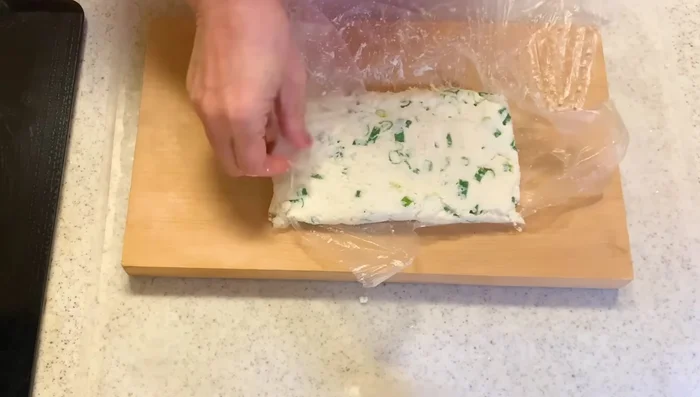 Roll the mixture into small balls and flatten slightly.