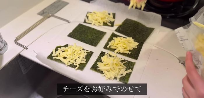Cut nori and place it on a cooking sheet. Add cheese, and microwave for 4 minutes.