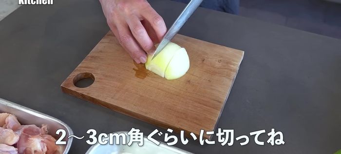 Prepare the ingredients: Cut onions into small pieces (113.92). Mince garlic (145.44). Make cuts in the chicken thighs to help release flavor (170.239).