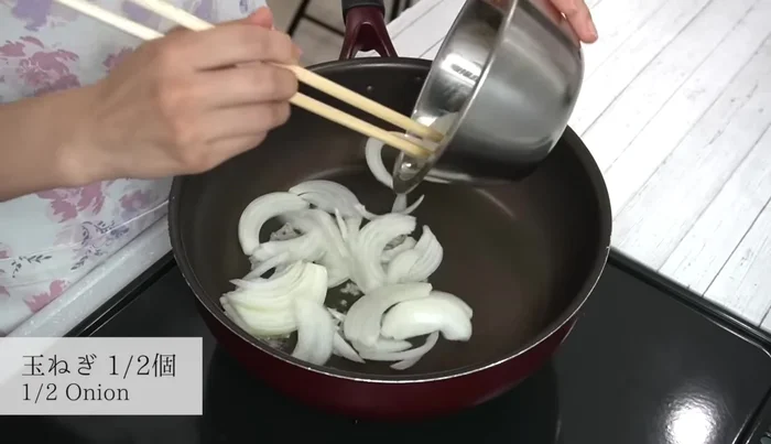 Add the onions and stir-fry for about 2 minutes until slightly colored and puffed.