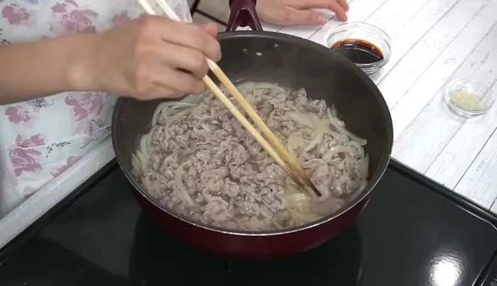 Cook for about 1 minute. Add kelp stock and soy sauce, continue cooking and stirring for about 5 minutes to prevent drying. Adjust heat to medium-low.