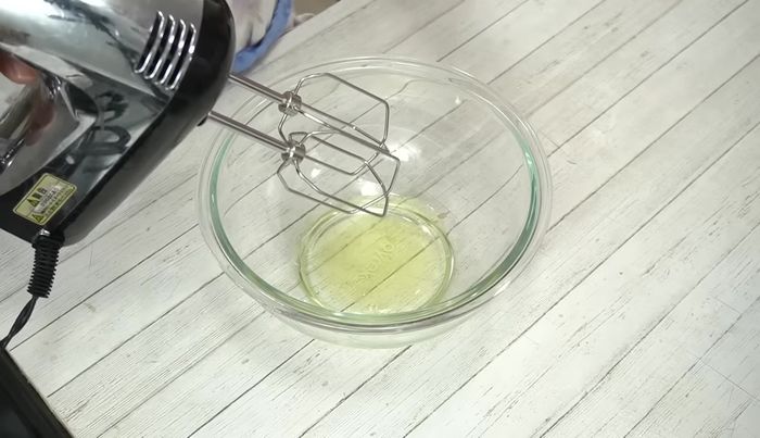 Whisk egg whites for 30 seconds on low speed with a hand mixer. Coarse bubbles will form.