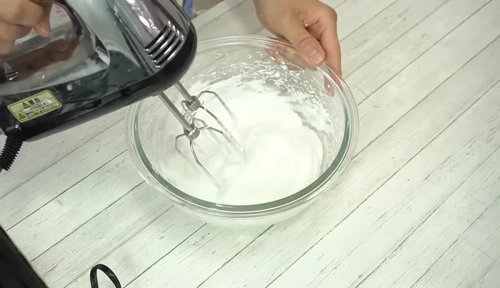 Add remaining granulated sugar, beat on high speed for 30 seconds. Stiff peaks should form.