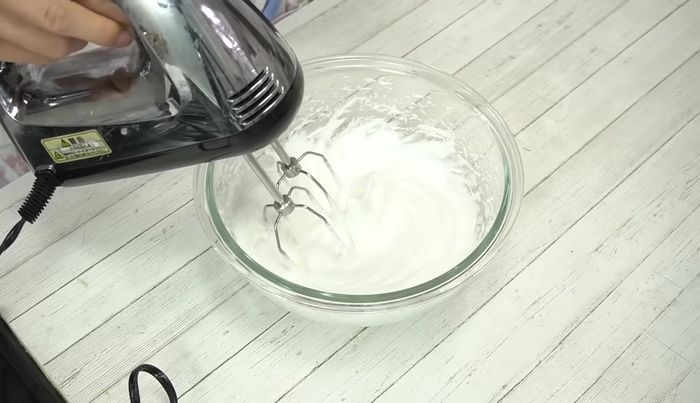 Beat on low speed for 1 minute to create a glossy, fine meringue.
