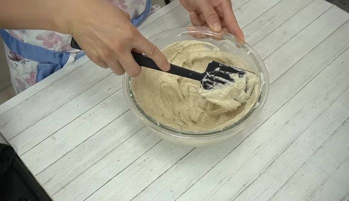 Macaronage: Press the batter against the bowl's edge to adjust consistency. The batter should slowly drip off the spatula in ribbons.