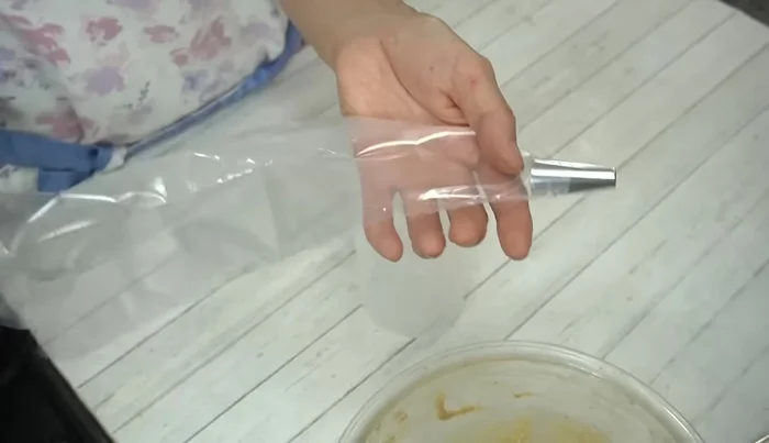 Transfer batter to a piping bag and pipe onto a baking sheet, leaving space between each macaron.