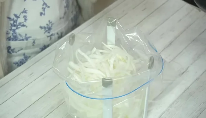 Place the onions in a heat-resistant ziploc bag. Pour the warm sauce over the onions, add olive oil, and seal the bag, removing as much air as possible.