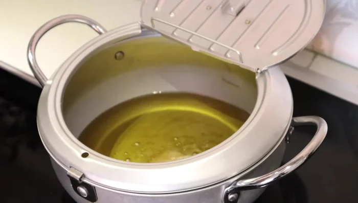 Deep-fry chicken until fully cooked. Remove from oil while hot.