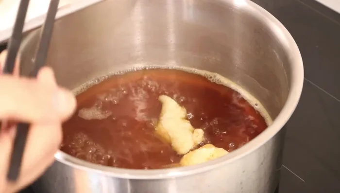 Bring soup to a boil, add chicken, and cook for one minute.