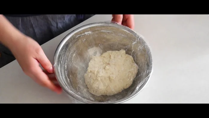 Shape the dough. Once the dough has risen sufficiently, it's time to shape it into a round or oval loaf.