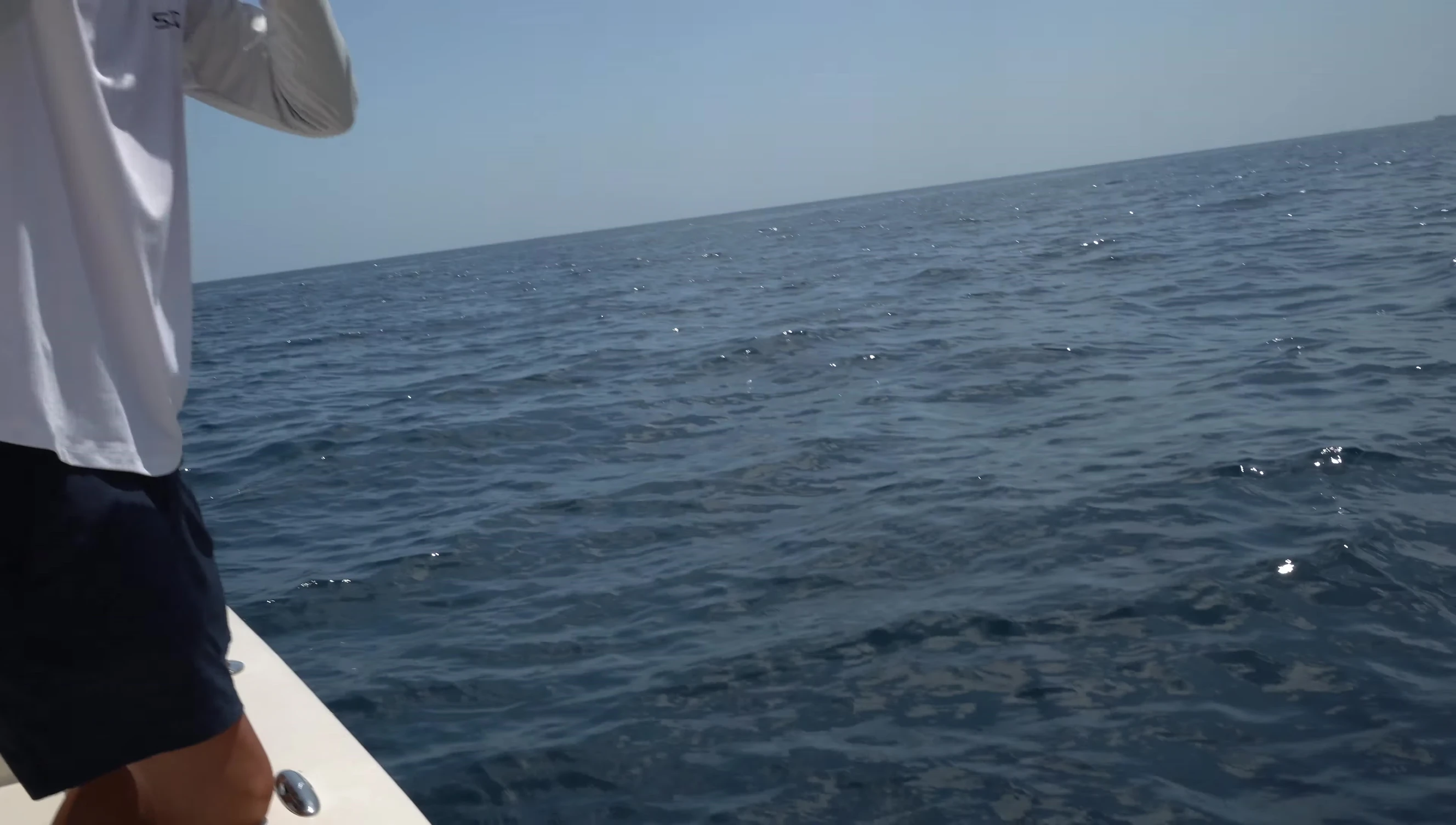 The narrator holding the second tuna.