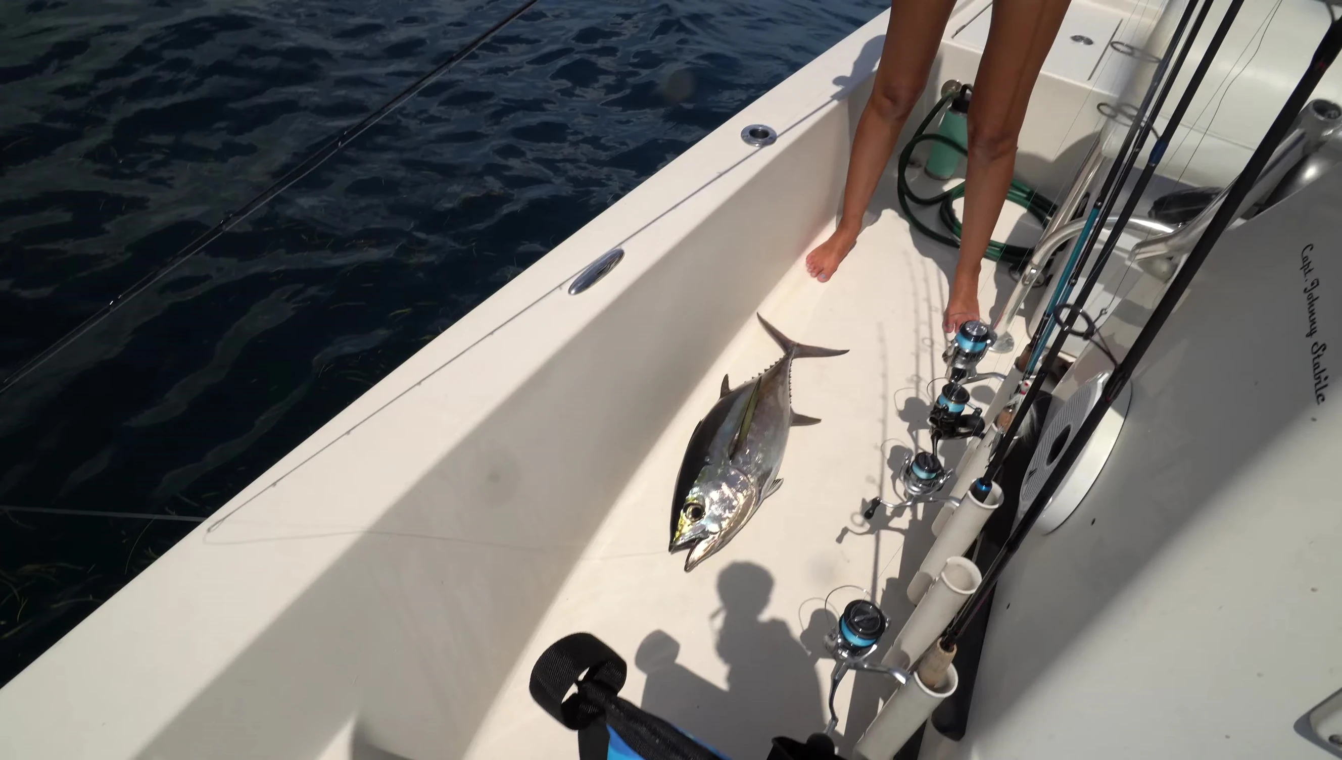 Laura holding her caught tuna.