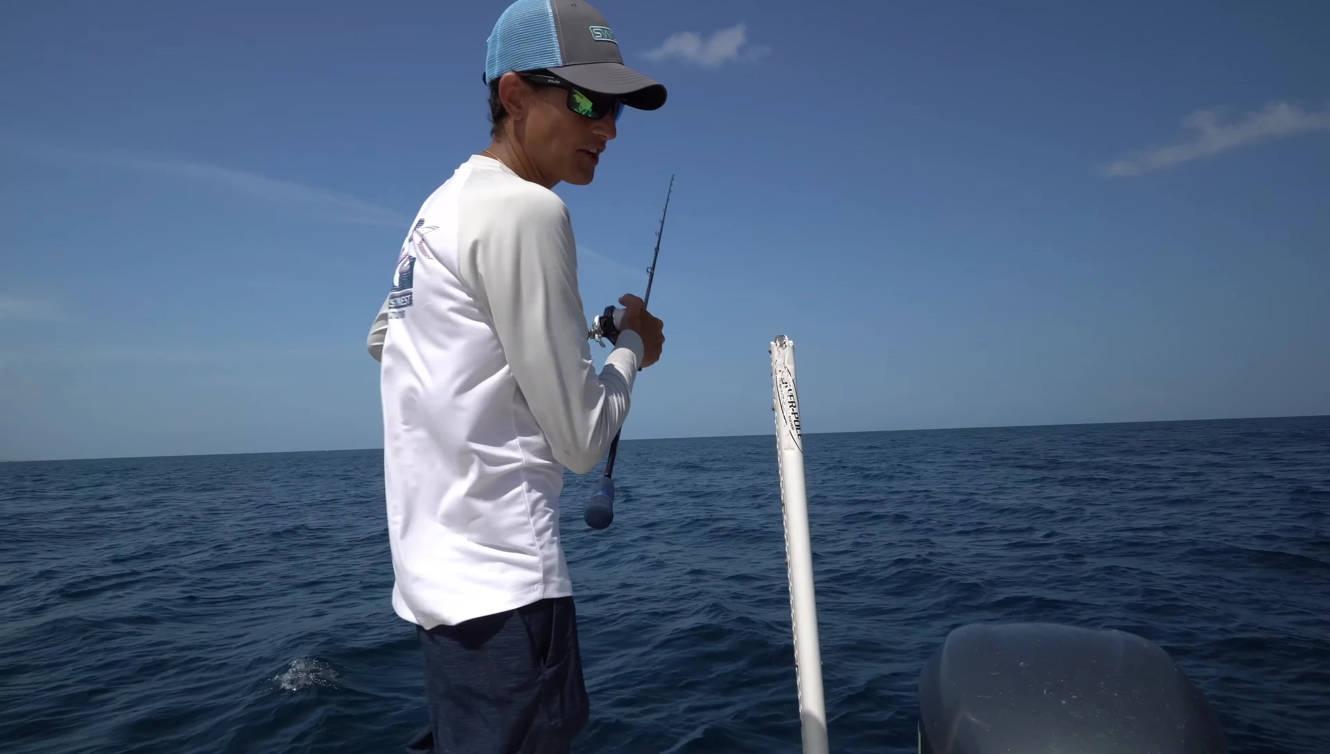 The narrator demonstrating the slow pitch jigging technique.