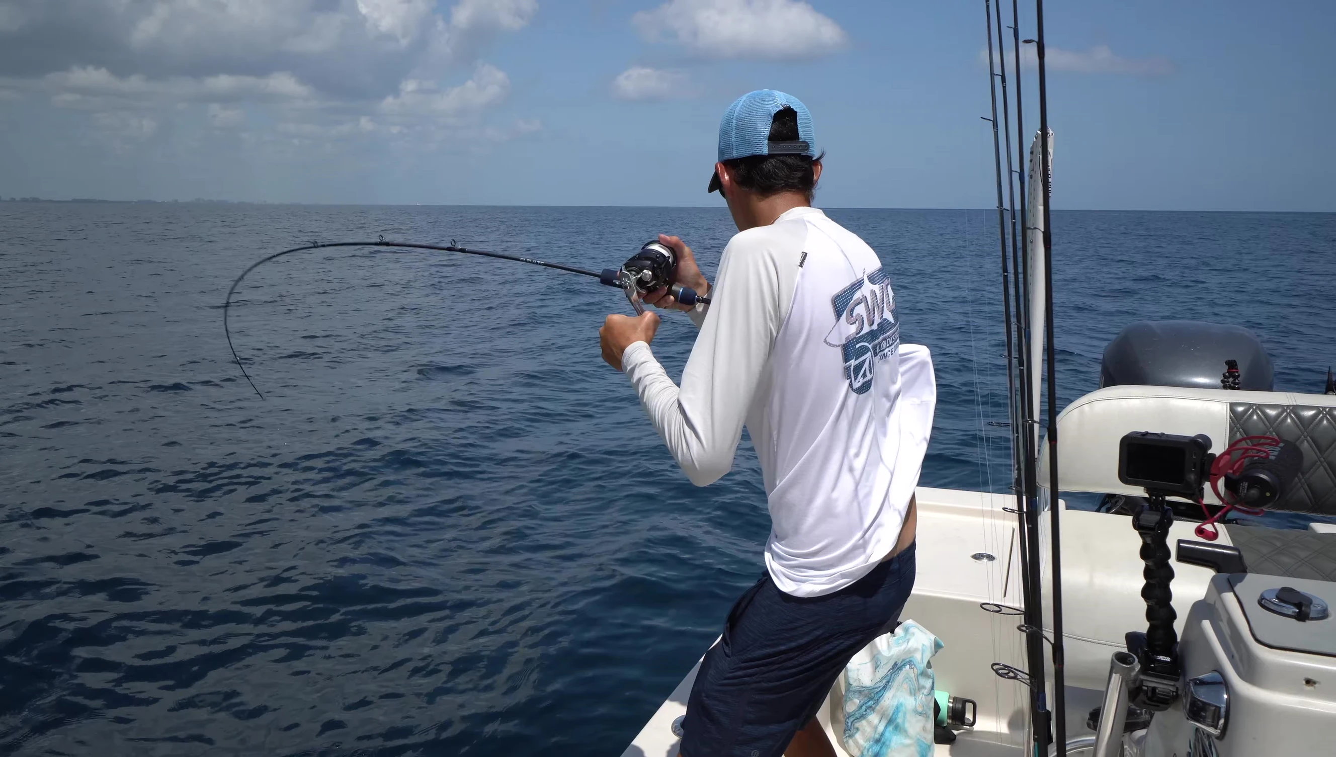 The narrator reeling in the first tuna.