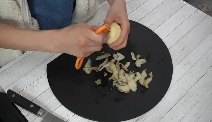 Peel and julienne the potatoes.