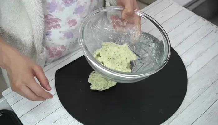 Check the dough's consistency. If crumbly, add a little water. Divide the dough in half, cover unused portion (257.12).