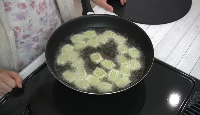 Fry potatoes until lightly browned, then turn. Use a wire rack to press down and remove air, preventing bursting (380.4).