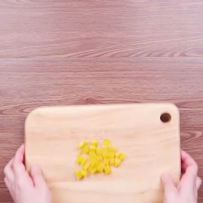 Combine the diced vegetables in a mixing bowl.