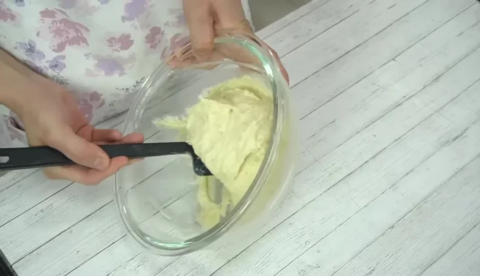 Add milk and mix until the dough is soft enough to break when lifted, similar in consistency to mochi.