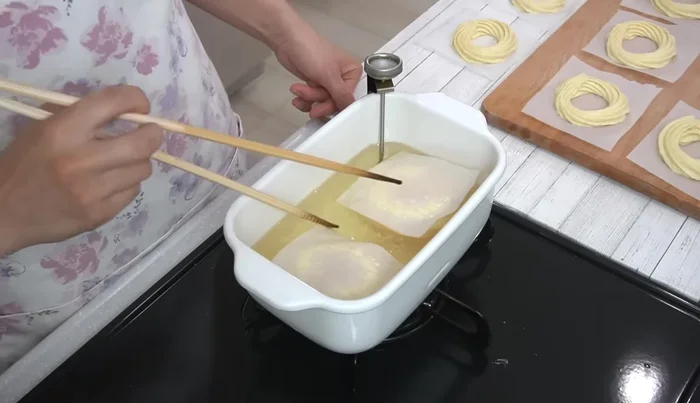 Fry for about 3 minutes total, flipping after 1 minute, until golden brown. Remove the parchment paper as it peels off.
