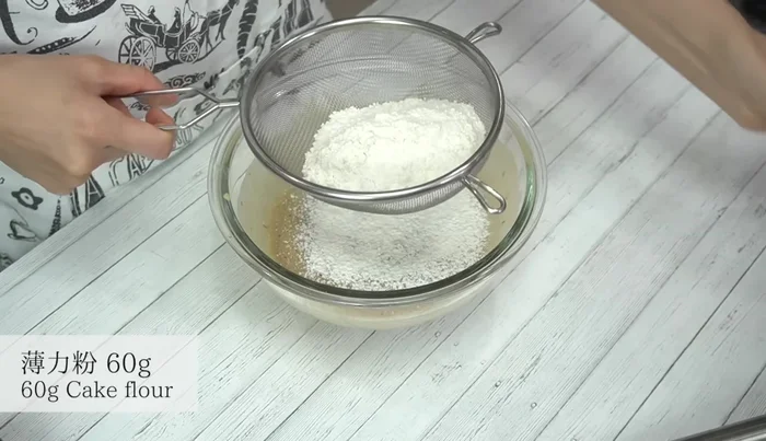 Sift in the cake flour and gently fold into the batter.