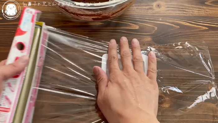 Line a small container with plastic wrap.