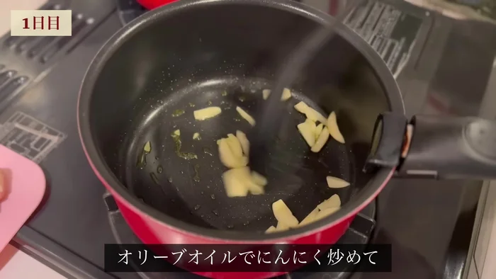 Fry garlic in olive oil. Add chicken breast and cook until browned on both sides.