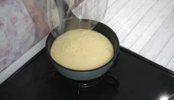 Pour batter over the bananas. Turn heat to very low, cover, and bake for 10 minutes.