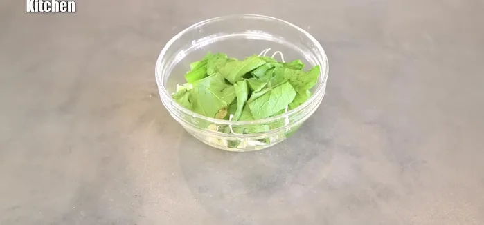 Remove the vegetables from the microwave once cooked.