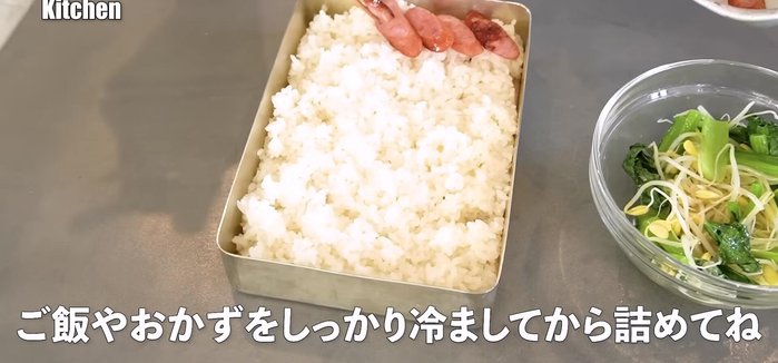 Assemble the bento box: layer rice, namul (komatsuna and bean sprouts), beef, and cooked eggs. Add optional ingredients like kimchi, seaweed, sesame seeds, and gochujang.