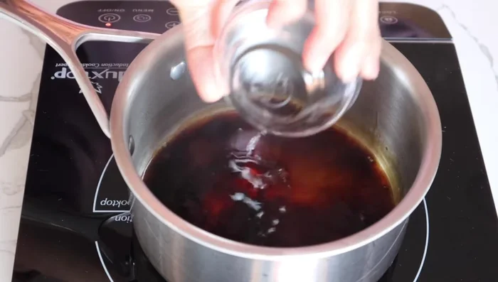 Make the sauce: In a small pot, combine soy sauce and sake. Bring to a brief boil and let cool completely.