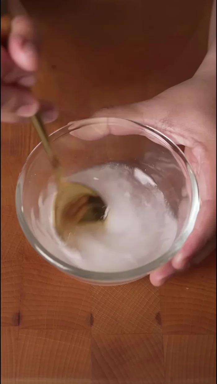 While the rice is warm, prepare the DIY sushi vinegar by mixing rice vinegar, sugar, and salt.
