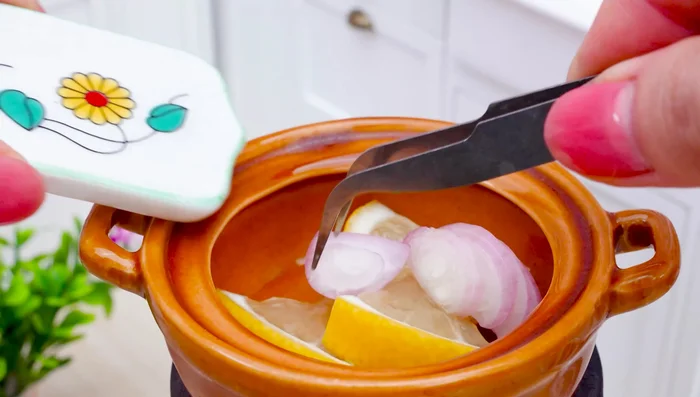 Boil the octopus. Place a layer of lemon and onion at the bottom of the pot.