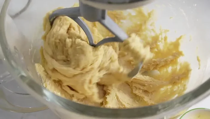 Knead the dough: Knead the dough for about 5 minutes in the stand mixer. Gradually add the butter and continue kneading for 10-15 minutes until soft and elastic.