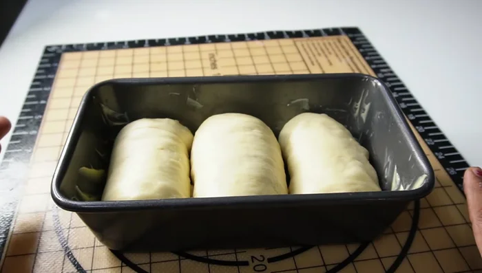 Second Rise: Cover the loaf pan and let the dough rise in a warm place until almost doubled (about 45 minutes).