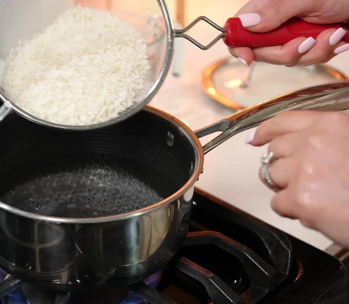 Cook sushi rice: Boil water, add rinsed rice, reduce heat, cover, and simmer for 15-20 minutes or until water evaporates.