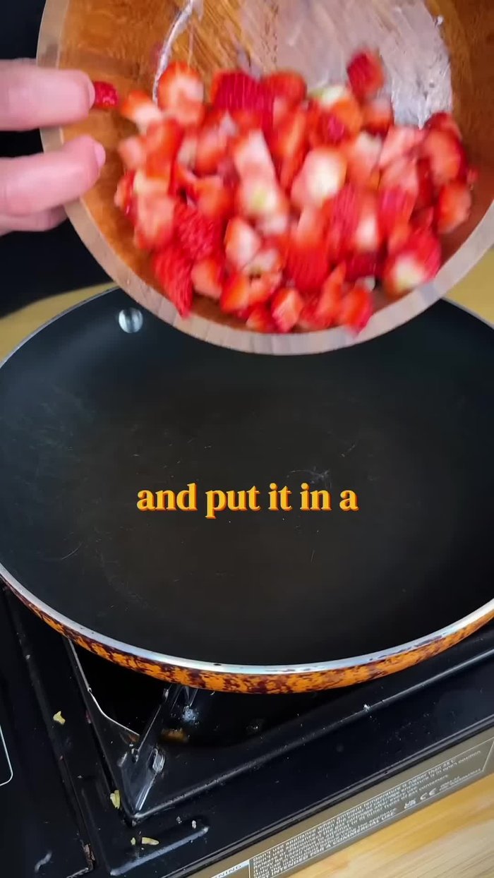 Cook the strawberries in a pan with sugar.