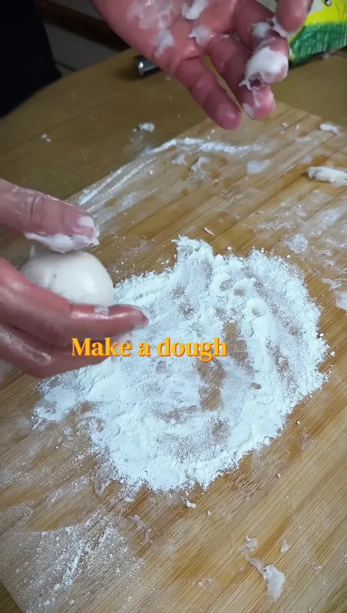 Make small dough balls, flatten, and add the strawberry mixture, whipped cream/yogurt/curd.
