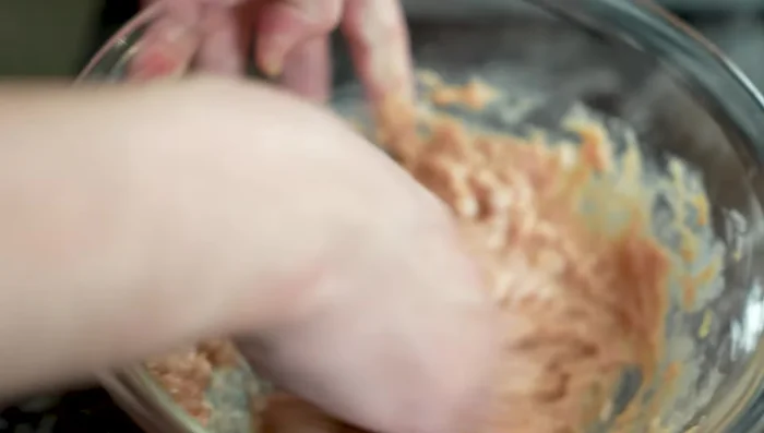Add egg white and mix thoroughly, using a whisk-like motion to incorporate air for a fluffy texture. Mix for 2-3 minutes.