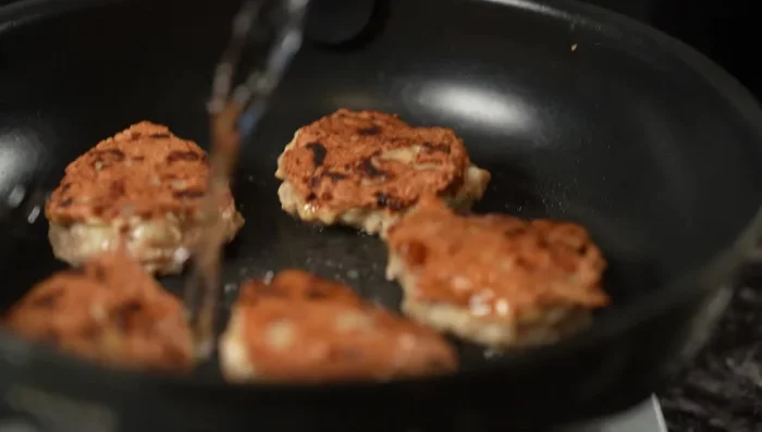 Add 2 tbsp sake to the pan, cover, and steam for 3-4 minutes to cook through and maintain fluffiness.