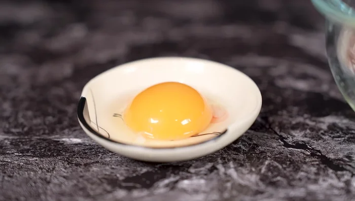 Separate egg yolk and white. Keep the yolk for garnish. Mix egg white with the meat later.