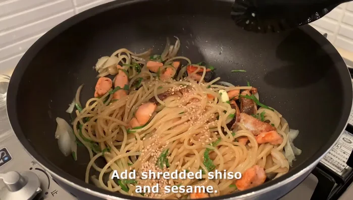 Finish pasta: Stir in shredded shiso and sesame seeds. Sprinkle black pepper.