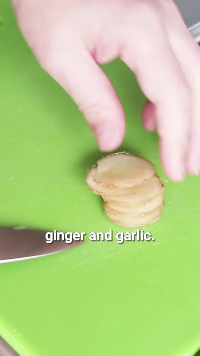 Roll the pork belly tightly and secure it with kitchen twine.