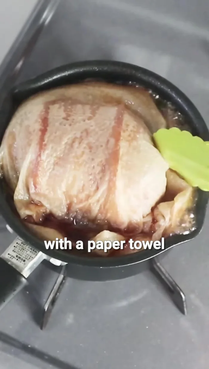 Simmer for 30 minutes, flip the pork, and simmer for another 30 minutes.