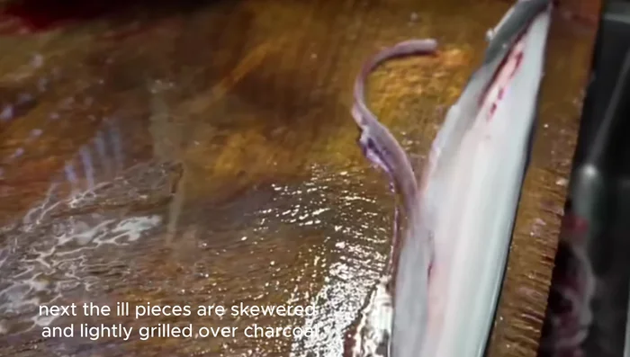Lightly grill over charcoal to remove excess fat and reduce the fishy smell.