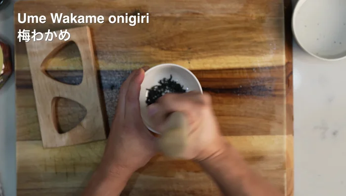Ume Wakame Onigiri: Crush dried wakame, mix with rice, sesame oil, ume, and sesame seeds.